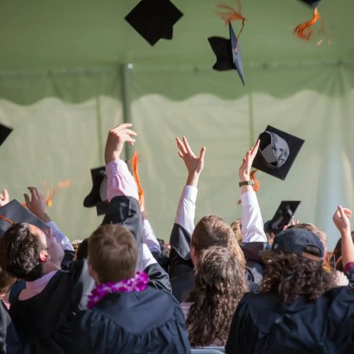 Secondary students celebrating graduation